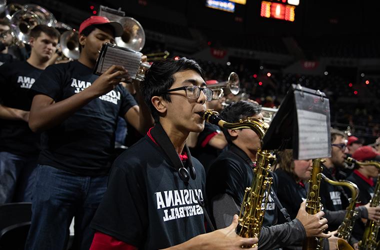 Louisiana Ragin' Brass Band performs at a basketball game in the Cajundome